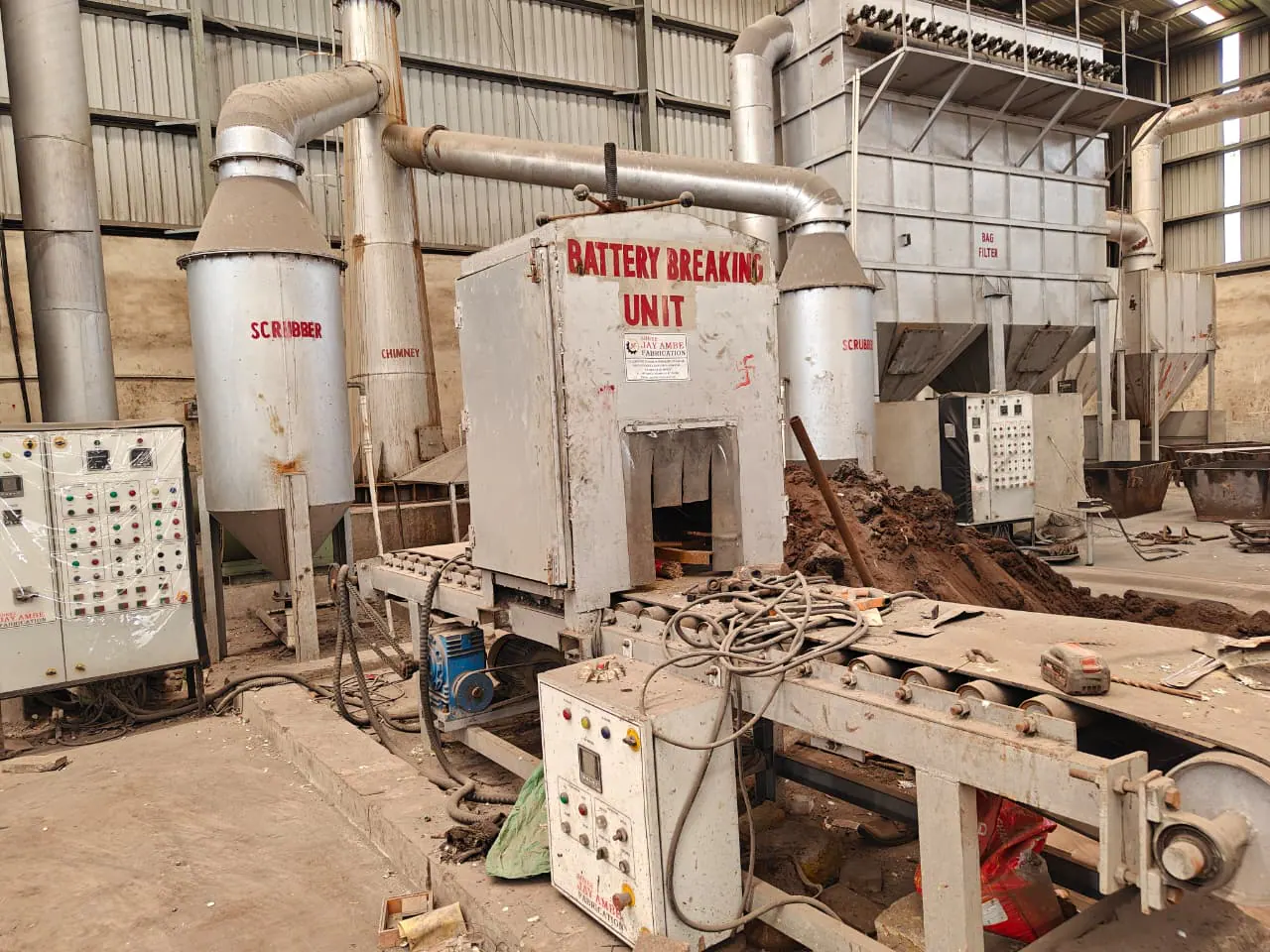 Installed battery processing line with conveyors and connected scrubber and bag-filter equipment