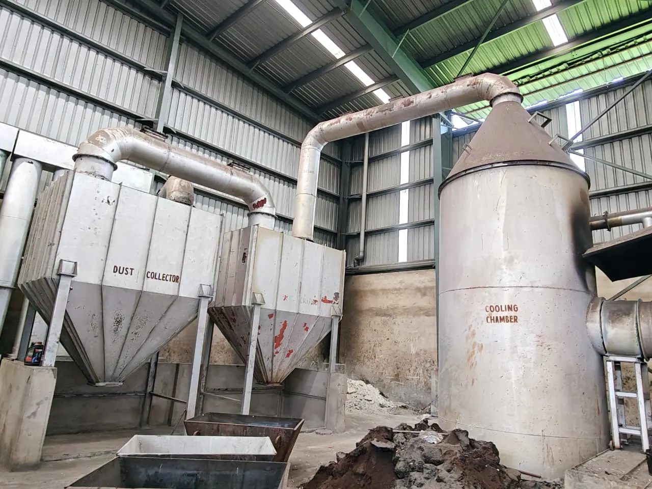 Fabricated cooling chamber connected to multiple hopper-bottom dust-collection units and ducting