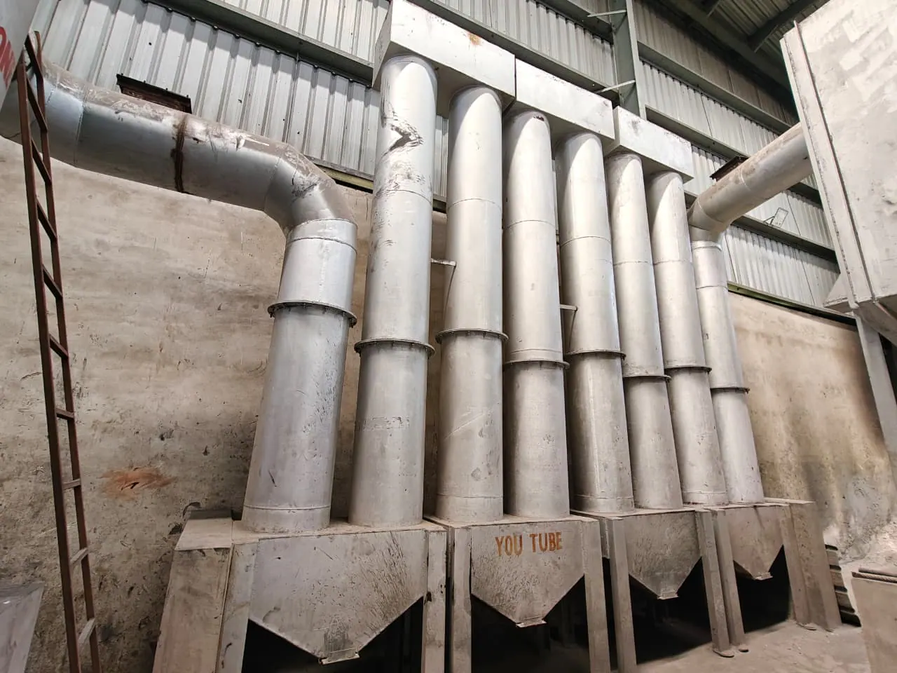 Bank of vertical separation tubes connected to common upper and lower fabricated manifolds